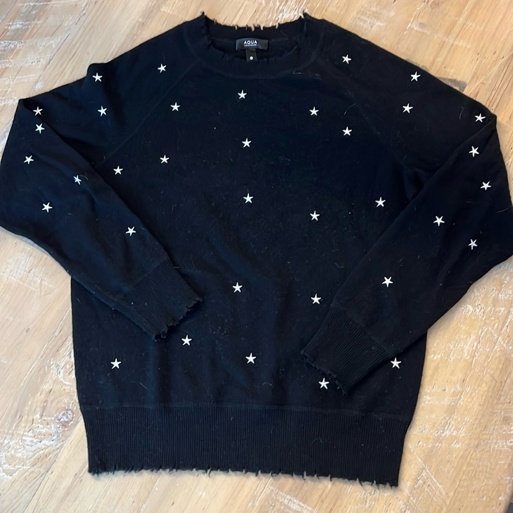 100% cashmere sweater from Bloomingdales.
Black w/embroidered small white stars.